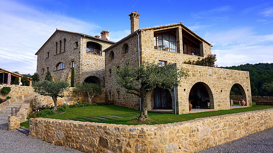 beige stone 2-storey house during daytime