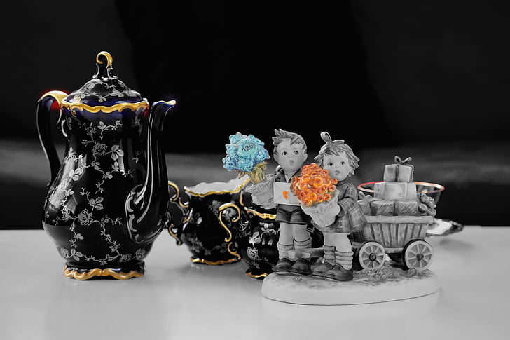 close up photo of figurines and tea set