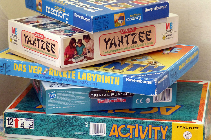 stack of assorted-brand board game boxes