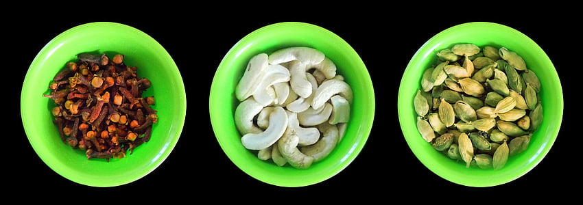 three assorted seasonings on white bowls