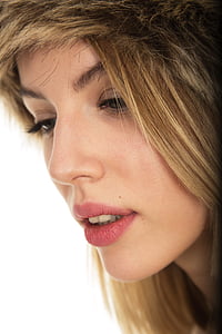 close-up photo of brown haired woman with pink lipstick