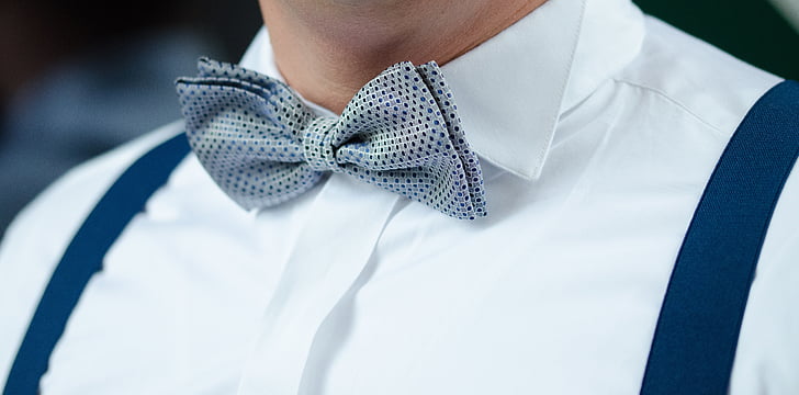 man in grey and black bow tie