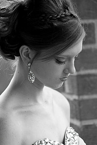 grayscale photography of woman wearing earrings
