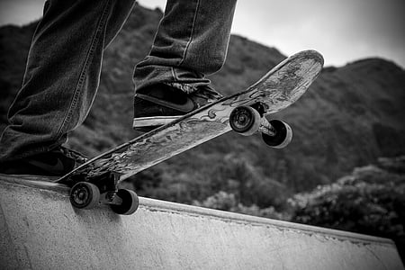 greyscale photography of person skateboarding
