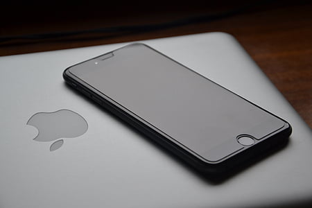 black iPhone 7 and MacBook