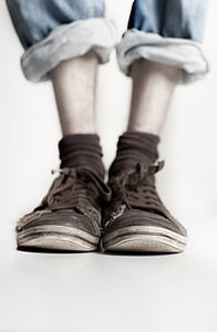 person wearing brown shoes in tilt shift photography