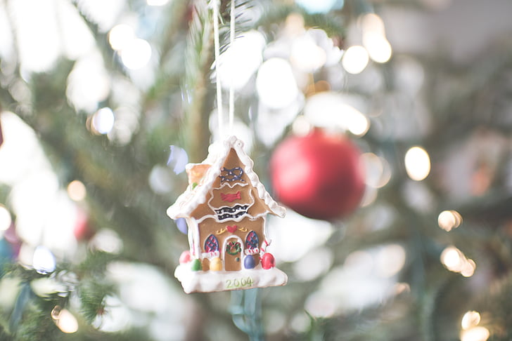 bokeh photograph of gingerbread house ornament