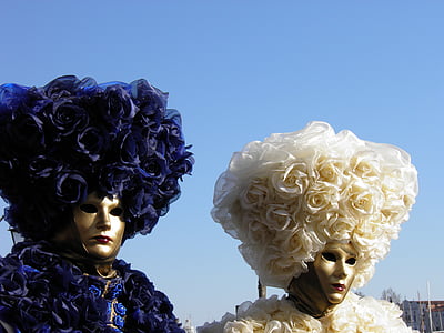 two mannequin wearing floral hat decors