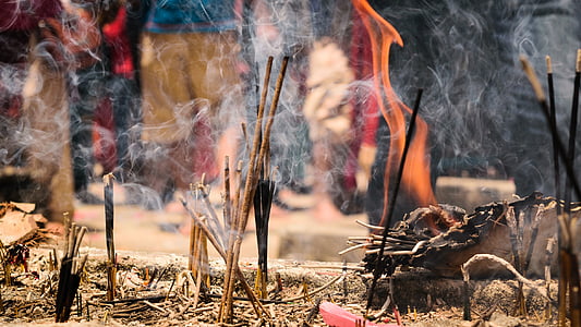 selective focus photography of burnt incenses