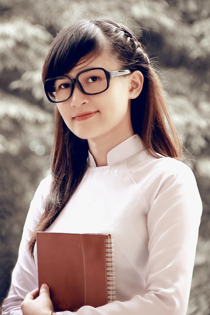 shallow focus photography of smiling woman wearing black eyeglasses