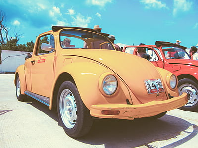 yellow Volkswagen Beetle convertible