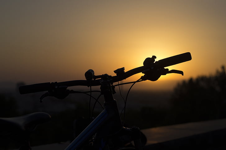 silhouette of bicycle during golden hour