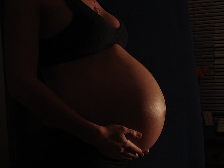 pregnant woman wearing black brassiere