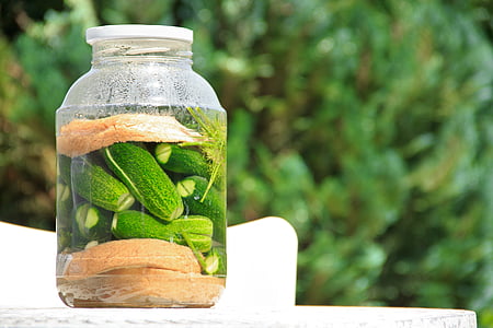 green vegetables inside clear glass jar