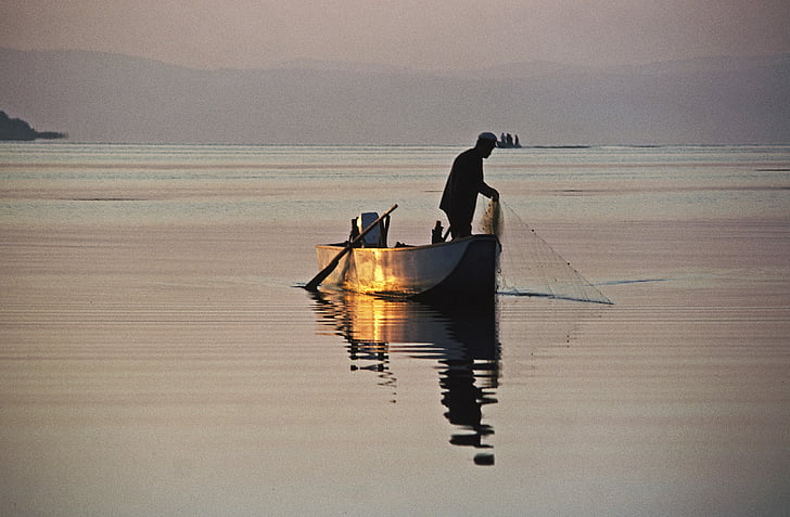 man on boat during daytime