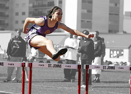 woman in purple tank top jumping