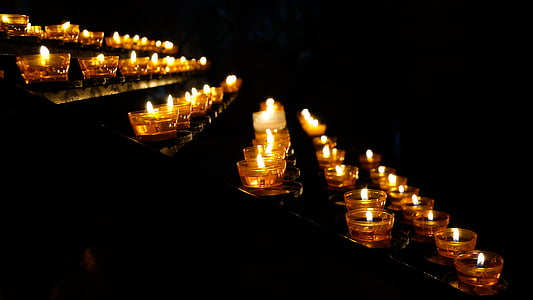 low light photography of votive candles lighted up