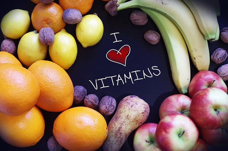 i love vitamins text surrounded by assorted fruits