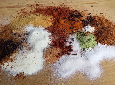 spices on brown surface