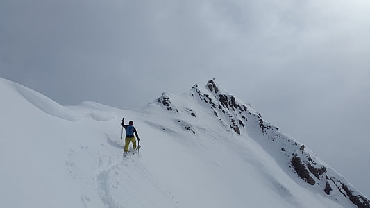 man skiing on snow covered mountain