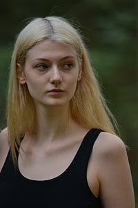 portrait photography of blonde haired woman in black tank top