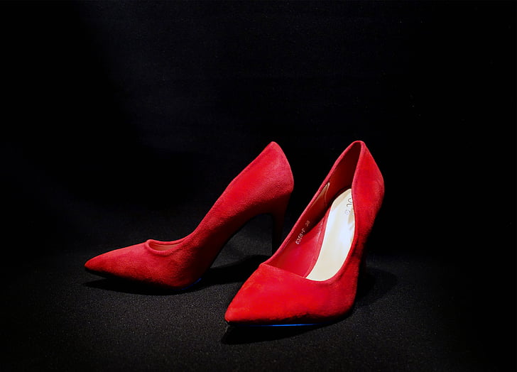 closeup photo of red leather pointed-toe heeled shoes