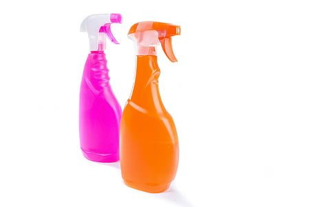 two pink and orange plastic sprayer bottles