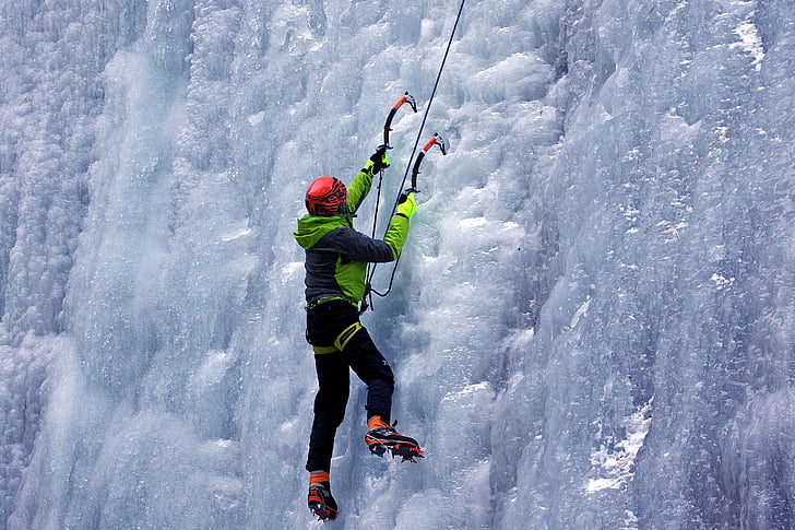 person ice climbing with harness