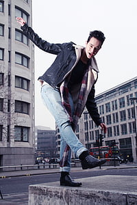 fashion photography of man on gray concrete pavement