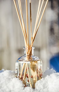 incense sticks on clear glass container