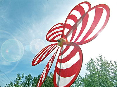 red and white striped nylon flower windmill at daytime