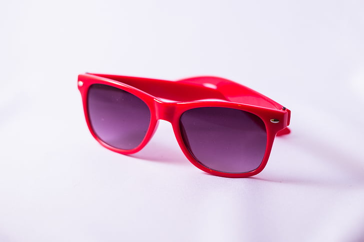 closeup photo of red wayfarer-style sunglasses