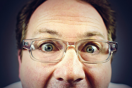 man wearing clear framed eyeglasses