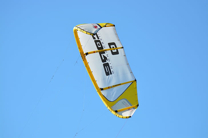 white and yellow parachute on air