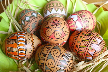seven brown and multicolored tribal egg decors
