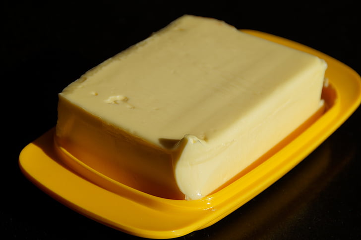 butter on yellow plastic tray