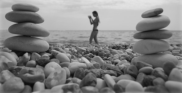 grayscale photo of woman at seashore