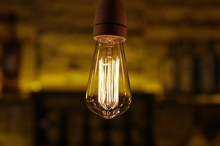 shallow focus photography of lighted bulb