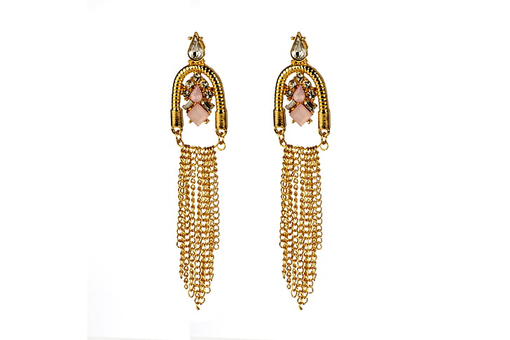 pair of gold-colored dangling earrings