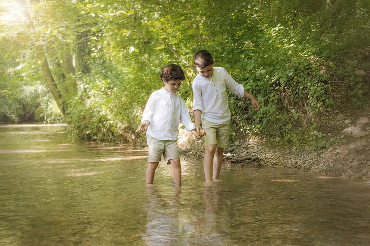 two boy's walking on water