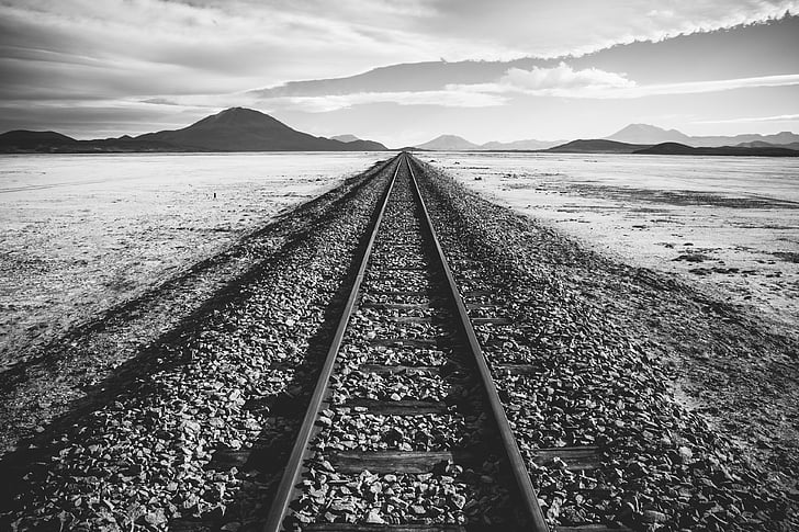 grascale photo of train tracks