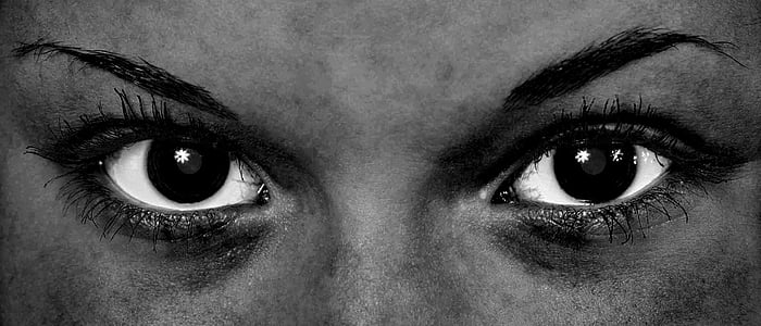 grayscale photo of person's eyes