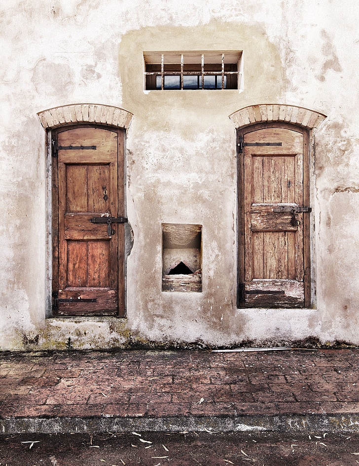 two brown wooden doors are closed