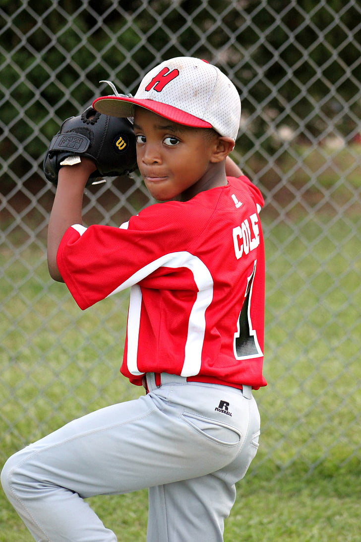 baseball player kid wearing red and white jersey shirt with white pants outfit