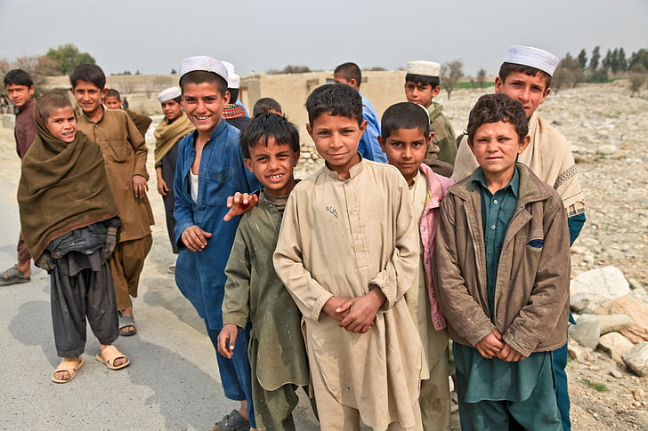 photography of group of kids near street