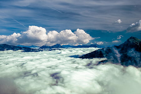 aerial photography of mountains and clouds