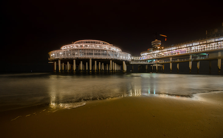 lighted pier near seashore