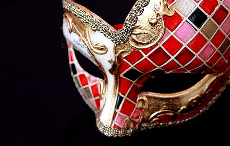 red and gold masquerade mask