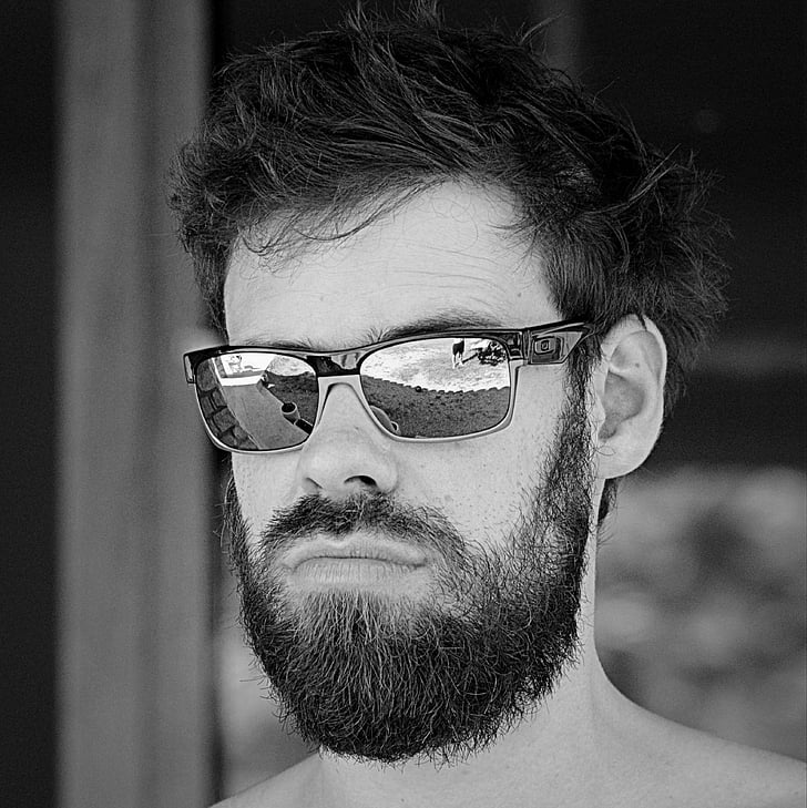 grayscale photography of man in Oakley sunglasses