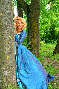 woman wearing blue long-sleeved maxi dress